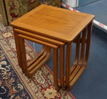 A nest of three Parker Knoll teak occasional tables, width 48cm, depth 42cm, height 49cm